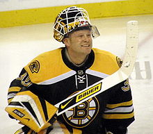 Tim Thomas souriant sous les couleurs des Bruins de Boston.