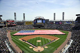 US Navy 100406-N-1232M-001 Sailors assigned to various commands at Naval Station Great Lakes unfurl an American flag before the 2010 home opening Chicago White Sox baseball game.jpg