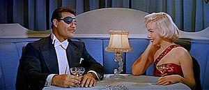 Alexander D'Arcy and Marilyn Monroe in How to Marry a Millionaire trailer.jpg